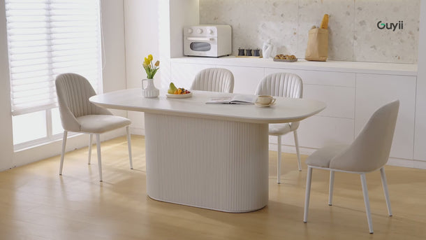 A versatile oval dining table adaptable to various dining arrangements and styles.